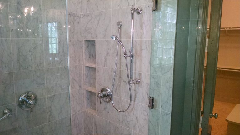 Bathroom remodeling featuring carrara marble tile. hansgrohe fixtures. Fort Worth