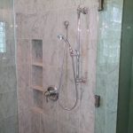 Bathroom remodeling featuring carrara marble tile. hansgrohe fixtures. Fort Worth