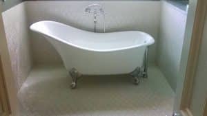Claw foot soaking tub and plumbilg risers to fit tub with no waste of room