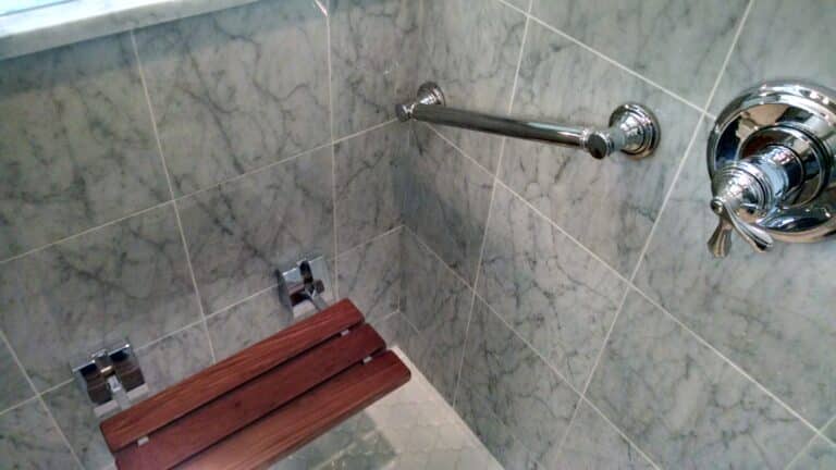 Shower chrome fixtures and fold upteak seat maximizing space